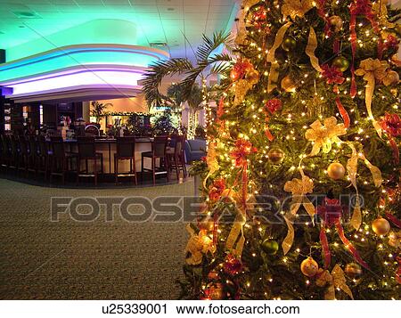 Stock Image -  Daytona Beach, FL, Florida, Daytona Beach Shores, Atlantic Ocean, Fairfield Resorts at Ocean Walk, Ocean Walk Resorts, lobby, bar, Christmas tree, decorations. Fotosearch