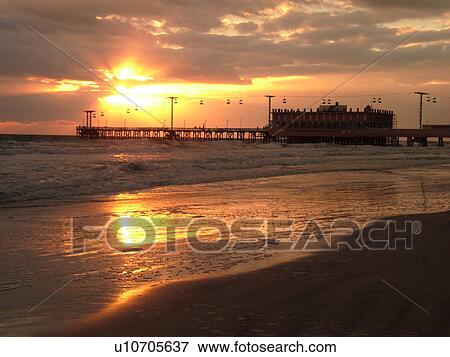 Stock Photo -  Daytona Beach, FL, Florida, Daytona Beach Shores, Atlantic Ocean, Main Street Pier & Boardwalk, beaches, sunrise. Fotosearch