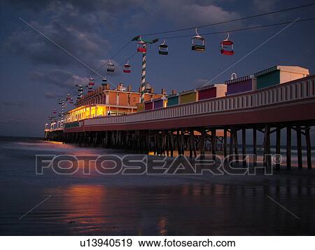 Stock Photo -  Daytona Beach, FL, Florida, Daytona Beach Shores, Atlantic Ocean, Main Street Pier & Boardwalk, gondola skyride, evening. Fotosearch