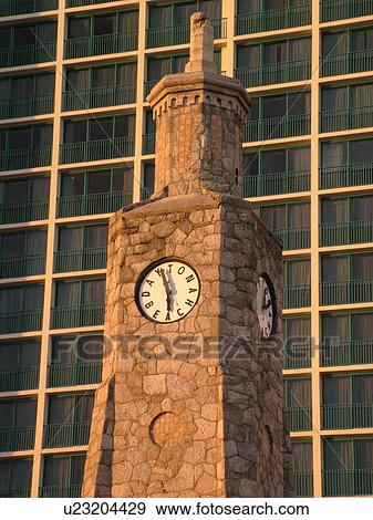 Stock Photo -  Daytona Beach, FL, Florida, Daytona Beach Shores, Atlantic Ocean, Ocean Walk, clock tower, Hilton Daytona Beach Ocean Front Resort. Fotosearch