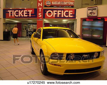 Stock Photography -  Daytona Beach, FL, Florida, Daytona International Speedway, Daytona USA, World Center of Racing, yellow Ford Mustang GT displayed. Fotosearch