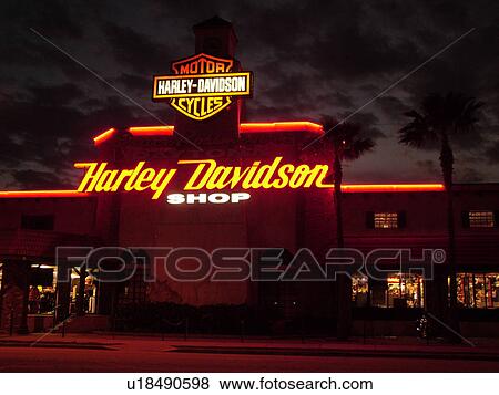 Stock Photo -  Daytona Beach, FL, Florida, Harley Davidson Motorcycle Shop, evening. Fotosearch