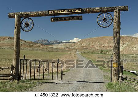 Stock Image -  Dubois, WY, Wyoming, Turtle Ranch, gate, open range, prairie. Fotosearch