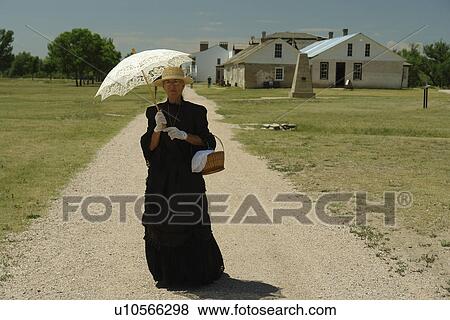 Stock Photo -  Fort Laramie, WY, Wyoming, Fort Laramie National Historic Site, pioneer woman. Fotosearch