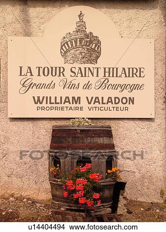 Picture -  France, Aluze, Burgundy, Saone et Loire, Europe, Burgundy Wine Region, winery, wine barrel decorated with flowers. Fotosearch