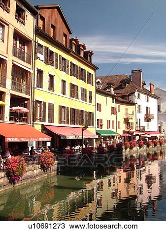 Stock Image -  France, Annecy, Haute-Savoie, Rhone-Alpes, Europe, village, Thiou Canal, restaurants, outdoor cafTs. Fotosearch