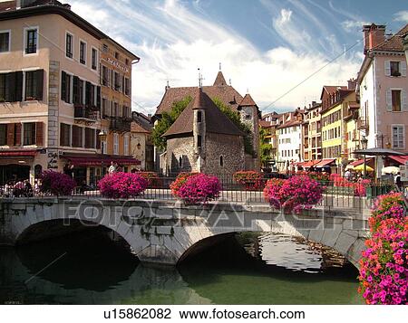 Stock Image -  France, Annecy, Haute-Savoie, Rhone-Alpes, Europe, village, Thiou Canal, stone bridge, Palais de l'Ile 12th-century prison. Fotosearch