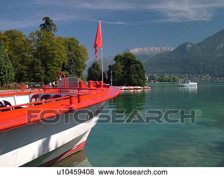 Stock Photo -  France, Annecy, Haute-Savoie, Rhone-Alpes, Europe, Lake Annecy, Lac d' Annecy, excursion boats, Lakeside park, mountains. Fotosearch