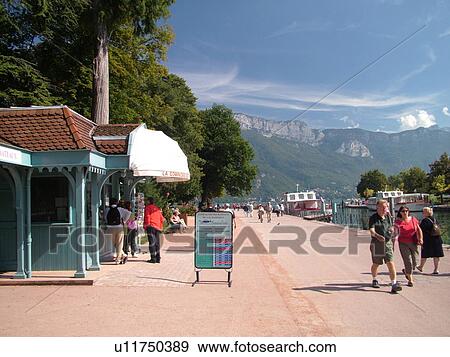 Stock Photo -  France, Annecy, Haute-Savoie, Rhone-Alpes, Europe, Lake Annecy, Lac d' Annecy, excursion boats, Lakeside park, mountains. Fotosearch