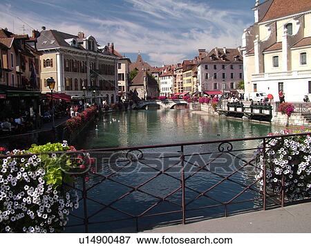 Stock Photo -  France, Annecy, Haute-Savoie, Rhone-Alpes, Europe, Thiou Canal, village, old quarter, flower-covered bridges. Fotosearch