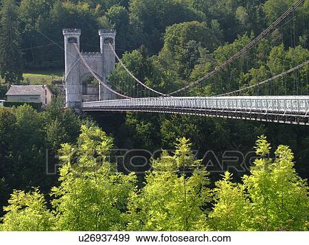 Stock Photo -  France, Annecy, Haute-Savoie, Rhone-Alpes, Europe, Pont de la Caille or Charles-Albert built in 1839 now a pedestrian bridge, suspension bridge. Fotosearch