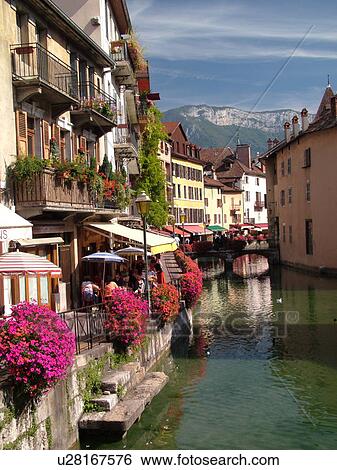 Stock Photograph -  France, Annecy, Haute-Savoie, Rhone-Alpes, Europe, village, Thiou Canal, restaurants, outdoor cafTs. Fotosearch