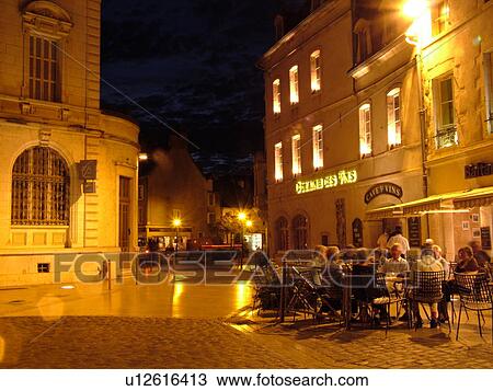 Stock Image -  France, Beaune, Burgundy, Cote de Beaune, Cote d'Or, Europe, Burgundy Wine Region, downtown, evening, outdoor cafT. Fotosearch