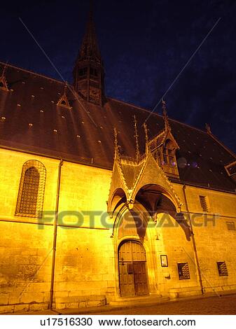 Stock Image -  France, Beaune, Burgundy, Cote de Beaune, Cote d'Or, Europe, Burgundy Wine Region, downtown, Hotel-Dieu, evening. Fotosearch