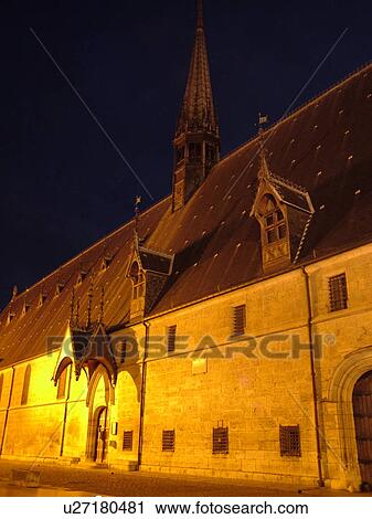 Stock Image -  France, Beaune, Burgundy, Cote de Beaune, Cote d'Or, Europe, Burgundy Wine Region, downtown, Hotel-Dieu, evening. Fotosearch