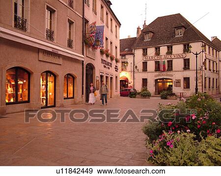 Stock Photo -  France, Beaune, Burgundy, Cote de Beaune, Cote d'Or, Europe, Burgundy Wine Region, downtown, evening. Fotosearch