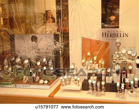 Stock Photo -  France, Beaune, Burgundy, Cote de Beaune, Cote d'Or, Europe, Burgundy Wine Region, broken window, jewelry store, break-in, robbery. Fotosearch
