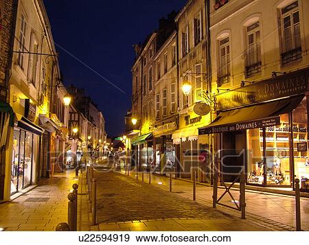 Stock Photo -  France, Beaune, Burgundy, Cote de Beaune, Cote d'Or, Europe, Burgundy Wine Region, downtown, evening. Fotosearch