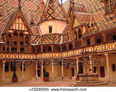 Stock Photography -  France, Beaune, Burgundy, Cote de Beaune, Cote d'Or, Europe, Burgundy Wine Region, downtown, Hotel-Dieu, Cour d'Honneur. Fotosearch