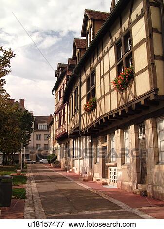 Stock Photo -  France, Chalon sur Saone, Burgundy, Saone et Loire, Europe, Burgundy Wine Region, narrow streets, half-timbered buildings. Fotosearch