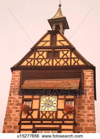 France, Dolder Tour Beffroi, Europe, Alsace, Riquewihr, Haut-Rhin, L'Alsace Wine Region, Route du Vin, downtown, half-timbered buildings, 13th century city gate, bell tower, clock tower View Large Photo Image Stock Photograph - France, Dolder Tour Beffroi, Europe, Alsace, Riquewihr, Haut-Rhin, L'Alsace Wine Region, Route du Vin, downtown, half-timbered buildings, 13th century city gate, bell tower, clock tower. Fotosearch