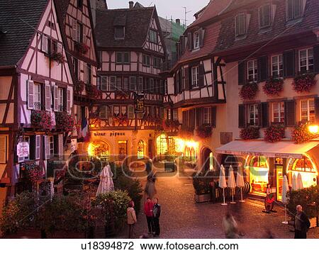 Stock Image -  France, Europe, Alsace, Colmar, Haut-Rhin, L'Alsace Wine Region, Route du Vin, downtown, evening, half-timbered buildings. Fotosearch