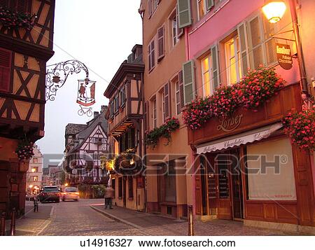 Stock Photo -  France, Europe, Alsace, Colmar, Haut-Rhin, L'Alsace Wine Region, Route du Vin, downtown, evening. Fotosearch