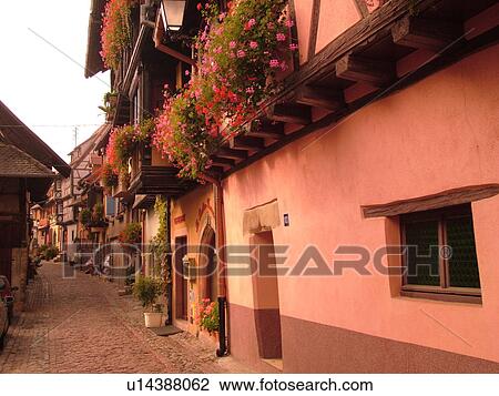France, Europe, Alsace, Eguisheim, Haut-Rhin, L'Alsace Wine Region, Route du Vin, picturesque village decorated with flowers, half-timbered buildings, narrow cobblestone pedestrian street View Large Photo Image Stock Image - France, Europe, Alsace, Eguisheim, Haut-Rhin, L'Alsace Wine Region, Route du Vin, picturesque village decorated with flowers, half-timbered buildings, narrow cobblestone pedestrian street. Fotosearch