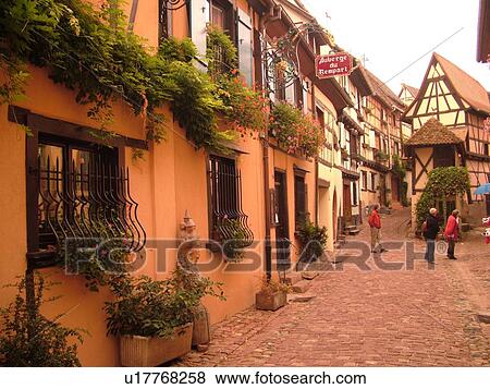 France, Europe, Alsace, Eguisheim, Haut-Rhin, L'Alsace Wine Region, Route du Vin, picturesque village, half-timbered buildings, narrow cobblestone pedestrian street View Large Photo Image Stock Photo - France, Europe, Alsace, Eguisheim, Haut-Rhin, L'Alsace Wine Region, Route du Vin, picturesque village, half-timbered buildings, narrow cobblestone pedestrian street. Fotosearch
