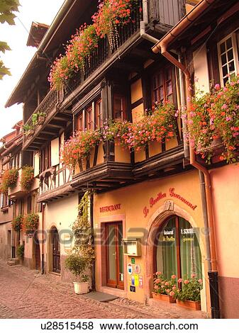 France, Europe, Alsace, Eguisheim, Haut-Rhin, L'Alsace Wine Region, Route du Vin, picturesque village decorated with flowers, half-timbered buildings View Large Photo Image Stock Photo - France, Europe, Alsace, Eguisheim, Haut-Rhin, L'Alsace Wine Region, Route du Vin, picturesque village decorated with flowers, half-timbered buildings. Fotosearch