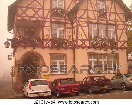 France, Europe, Alsace, Riquewihr, Haut-Rhin, L'Alsace Wine Region, Route du Vin, La Poste, downtown, half-timbered, building, fog View Large Photo Image Picture - France, Europe, Alsace, Riquewihr, Haut-Rhin, L'Alsace Wine Region, Route du Vin, La Poste, downtown, half-timbered, building, fog. Fotosearch