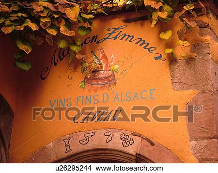 Picture -  France, Europe, Alsace, Riquewihr, Haut-Rhin, L'Alsace Wine Region, Route du Vin, close-up, fatade, caveau, winery, wine tasting. Fotosearch