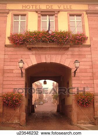 Stock Image -  France, Europe, Alsace, Riquewihr, Haut-Rhin, L'Alsace Wine Region, Route du Vin, Hotel de Ville, downtown, fog. Fotosearch