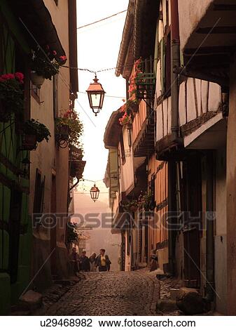 France, Europe, Alsace, Riquewihr, Haut-Rhin, L'Alsace Wine Region, Route du Vin, downtown, half-timbered buildings, cobblestone pedestrian street View Large Photo Image Stock Image - France, Europe, Alsace, Riquewihr, Haut-Rhin, L'Alsace Wine Region, Route du Vin, downtown, half-timbered buildings, cobblestone pedestrian street. Fotosearch