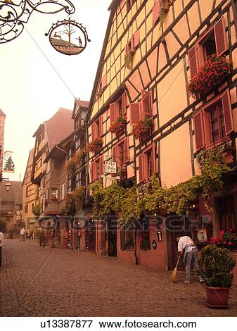 France, Europe, Alsace, Riquewihr, Haut-Rhin, L'Alsace Wine Region, Route du Vin, downtown, cobblestone pedestrian street, half-timbered buildings View Large Photo Image Stock Photo - France, Europe, Alsace, Riquewihr, Haut-Rhin, L'Alsace Wine Region, Route du Vin, downtown, cobblestone pedestrian street, half-timbered buildings. Fotosearch