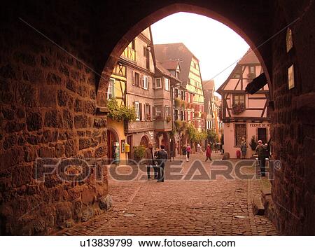 France, Europe, Alsace, Riquewihr, Haut-Rhin, L'Alsace Wine Region, Route du Vin, downtown, archway, cobblestone pedestrian street, half-timbered buildings View Large Photo Image Stock Photo - France, Europe, Alsace, Riquewihr, Haut-Rhin, L'Alsace Wine Region, Route du Vin, downtown, archway, cobblestone pedestrian street, half-timbered buildings. Fotosearch