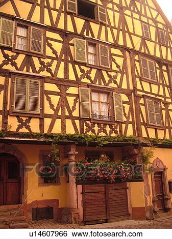 Stock Photograph -  France, Europe, Alsace, Riquewihr, Haut-Rhin, L'Alsace Wine Region, Route du Vin, downtown, half-timbered buildings. Fotosearch