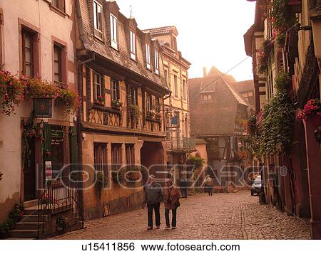 France, Europe, Alsace, Riquewihr, Haut-Rhin, L'Alsace Wine Region, Route du Vin, downtown, half-timbered buildings, cobblestone street, fog View Large Photo Image Stock Photograph - France, Europe, Alsace, Riquewihr, Haut-Rhin, L'Alsace Wine Region, Route du Vin, downtown, half-timbered buildings, cobblestone street, fog. Fotosearch