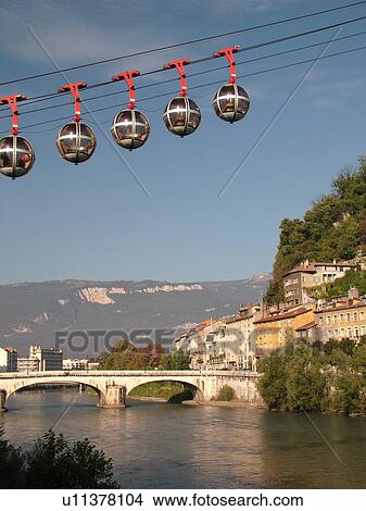 Picture -  France, Grenoble, Isere, Rhone-Alpes, Europe, Telepherique de la Bastille, gondola, Isere River. Fotosearch