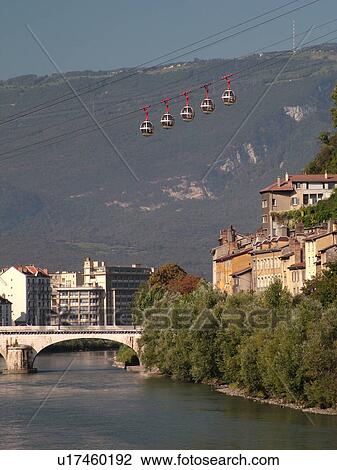 Stock Image -  France, Grenoble, Isere, Rhone-Alpes, Europe, Telepherique de la Bastille, gondola, Isere River. Fotosearch