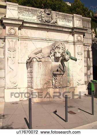 Stock Image -  France, Grenoble, Isere, Rhone-Alpes, Europe, downtown, lion fountain. Fotosearch