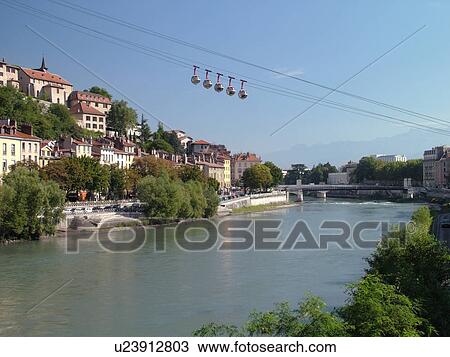 Stock Image -  France, Grenoble, Isere, Rhone-Alpes, Europe, Telepherique de la Bastille, gondola, Isere River. Fotosearch