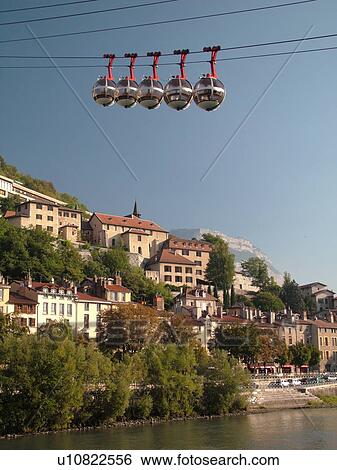 Stock Photograph -  France, Grenoble, Isere, Rhone-Alpes, Europe, Telepherique de la Bastille, gondola, Isere River. Fotosearch