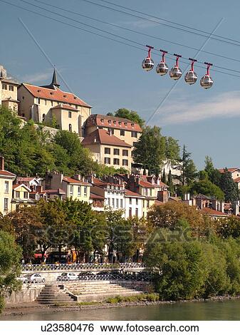 Stock Photograph -  France, Grenoble, Isere, Rhone-Alpes, Europe, Telepherique de la Bastille, gondola, Isere River. Fotosearch