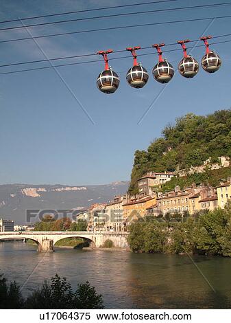 Stock Photography -  France, Grenoble, Isere, Rhone-Alpes, Europe, Telepherique de la Bastille, gondola, Isere River. Fotosearch