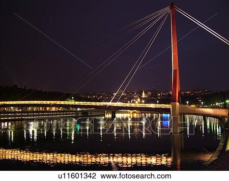 Stock Image -  France, Lyon, Rhone-Alpes, Europe, pedestrian bridge, Saone River, evening. Fotosearch