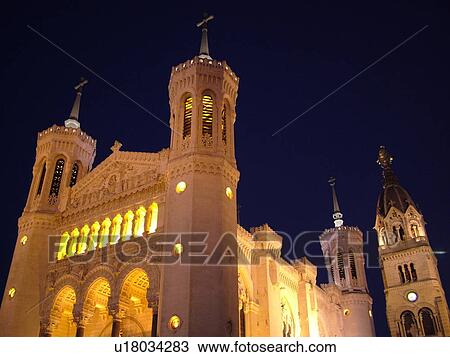 Stock Image -  France, Lyon, Rhone-Alpes, Europe, Basilique Notre-Dame de Fourviere, evening. Fotosearch
