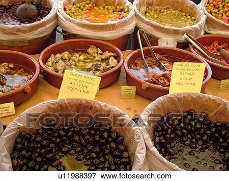 Stock Photo -  France, Lyon, Rhone-Alpes, Europe, downtown, City Market, olives for sale. Fotosearch