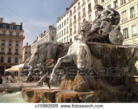 Stock Photo -  France, Lyon, Rhone-Alpes, Europe, downtown, 19th century fountain, four horses pulling the chariot, Place des Terreaux. Fotosearch