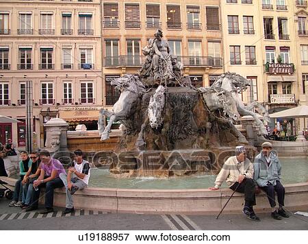 Stock Photo -  France, Lyon, Rhone-Alpes, Europe, downtown, 19th century fountain, four horses pulling the chariot, Place des Terreaux. Fotosearch